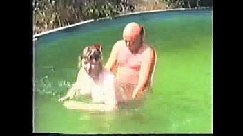 Older amateur couple in pool